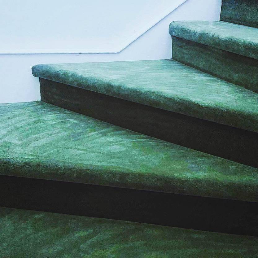 green carpeted staircase