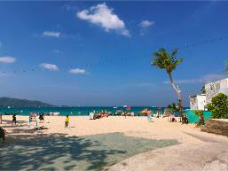 Beach area with ocean view near hotel resort entrance