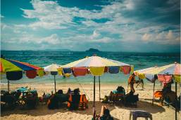 Beach area with umbrellas and seating for hotel guests