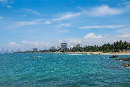 Coastal view of hotel area with ocean and beach scenery