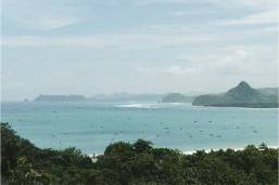 Ocean view with distant islands and greenery from hotel location