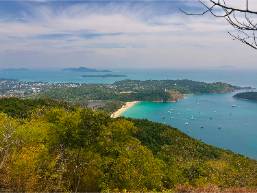 View of coastal beach area and ocean from a hillside