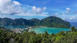 Scenic view of a coastal area with beach and hills