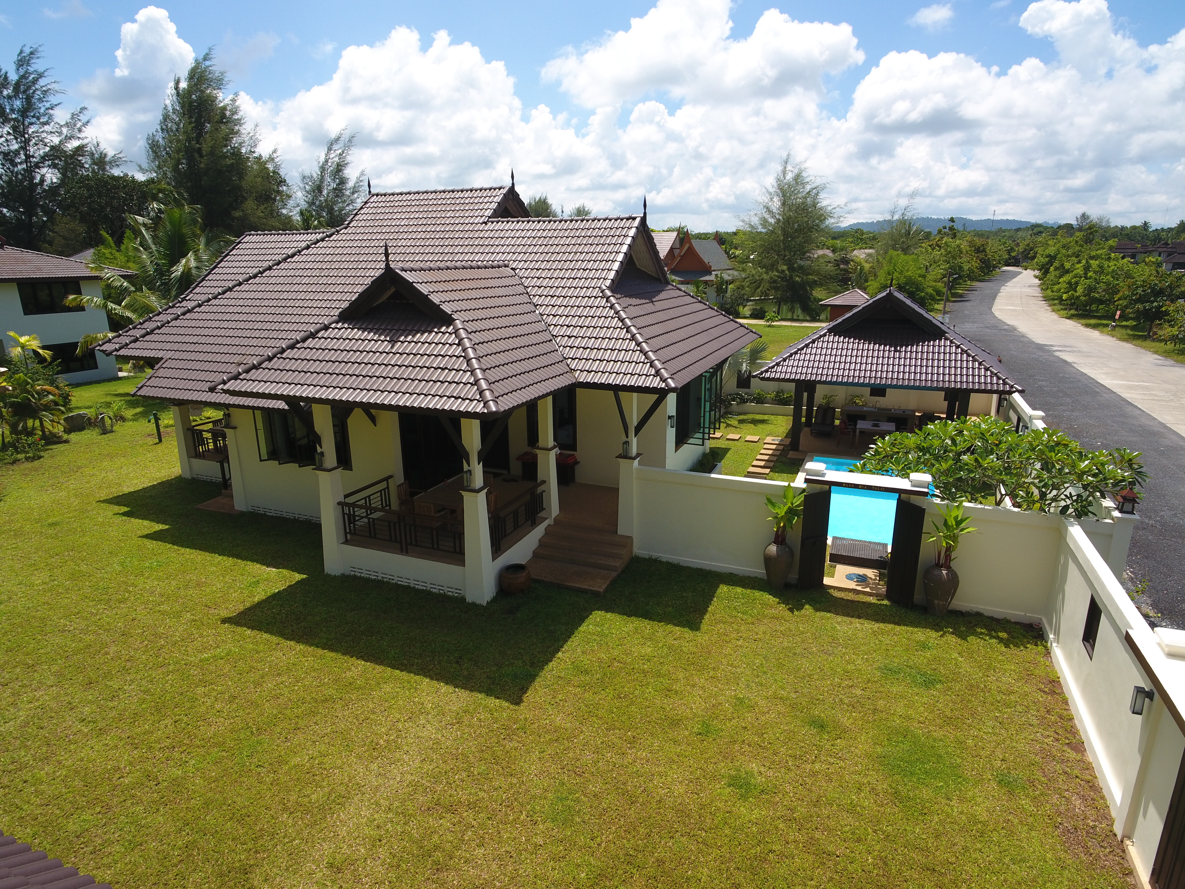 Owner-supplied aerial/drone still from the Thai Life Beach House property archive (DJI_0121). Useful for understanding the property and surrounding setting; it should not be treated as a survey or boundary plan.