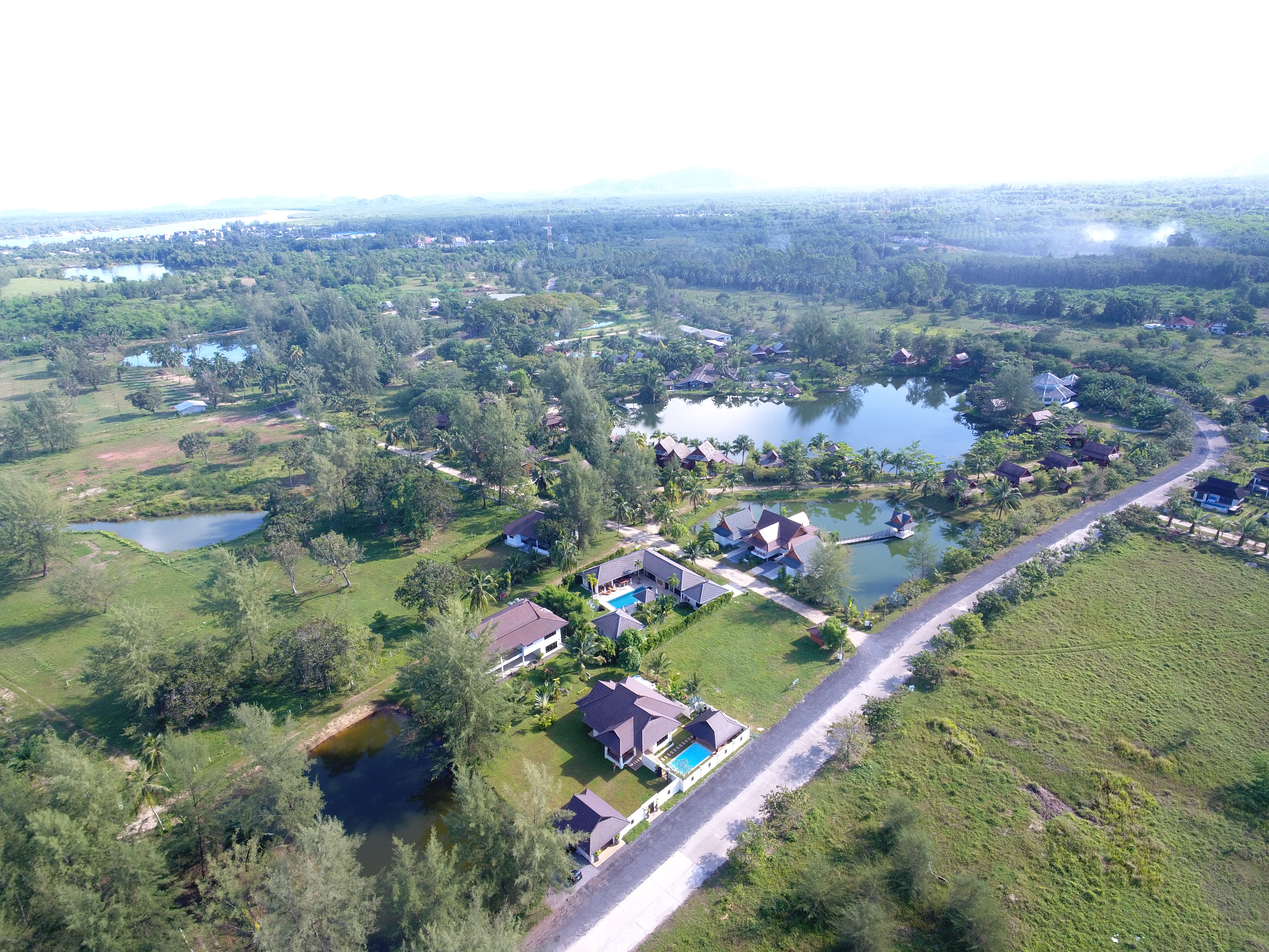 Owner-supplied aerial/drone still from the Thai Life Beach House property archive (DJI_0129). Useful for understanding the property and surrounding setting; it should not be treated as a survey or boundary plan.