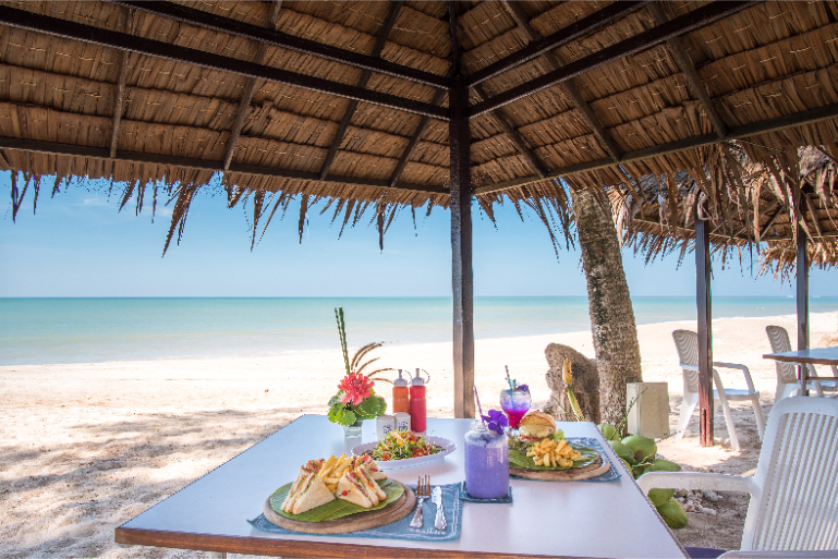 Beachfront Dining Table Tropical Drinks - ThaiLife Meditation & Wellness Resort