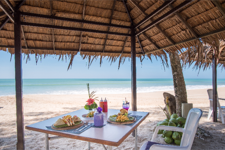 Beachfront Restaurant Table With Food Drinks - ThaiLife Meditation & Wellness Resort