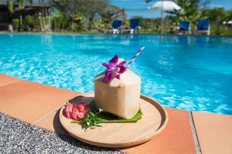 Refreshing Coconut Drink By Pool - ThaiLife Meditation & Wellness Resort