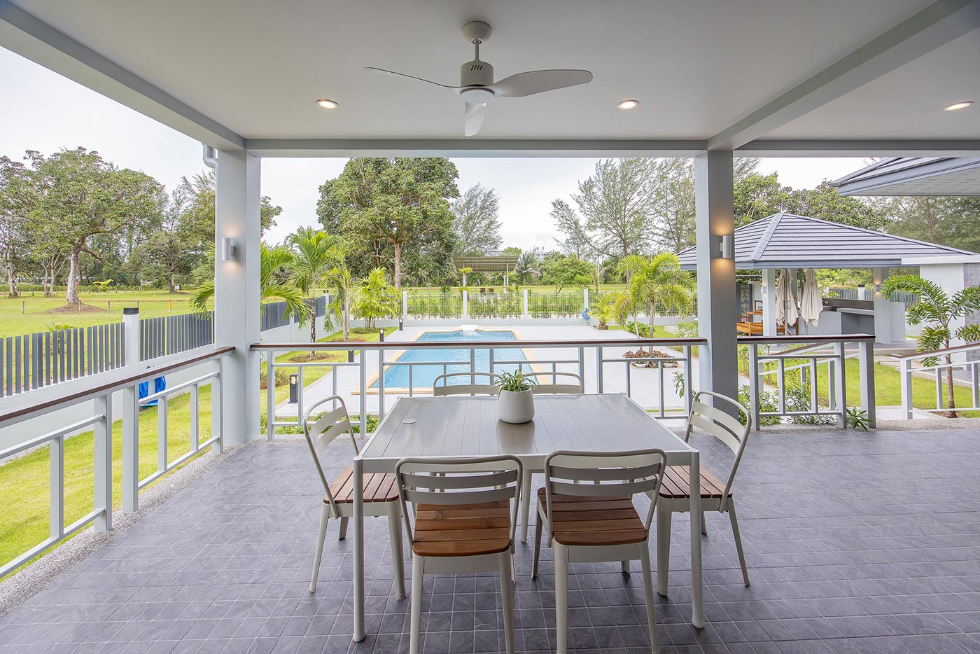 Official ThaiLife Residences project image showing covered patio dining table pool view for the Bang Muang, Takua Pa development. Confirm whether the image is completed-property photography, a show unit or a design visualisation before using it as construction-status evidence.
