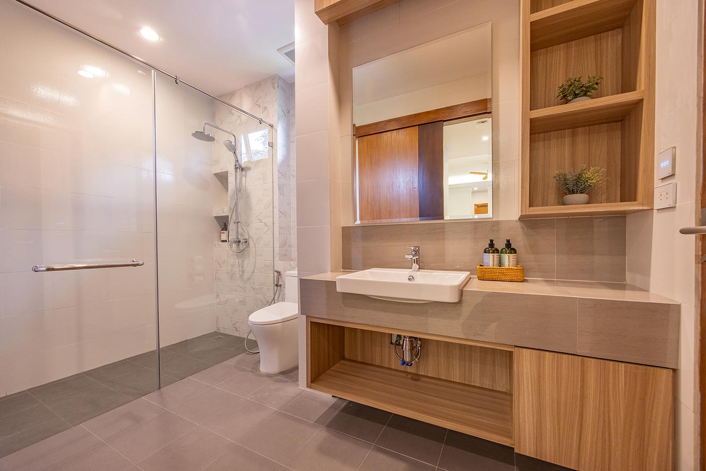 Official ThaiLife Residences project image showing modern bathroom with glass shower and vanity for the Bang Muang, Takua Pa development. Confirm whether the image is completed-property photography, a show unit or a design visualisation before using it as construction-status evidence.