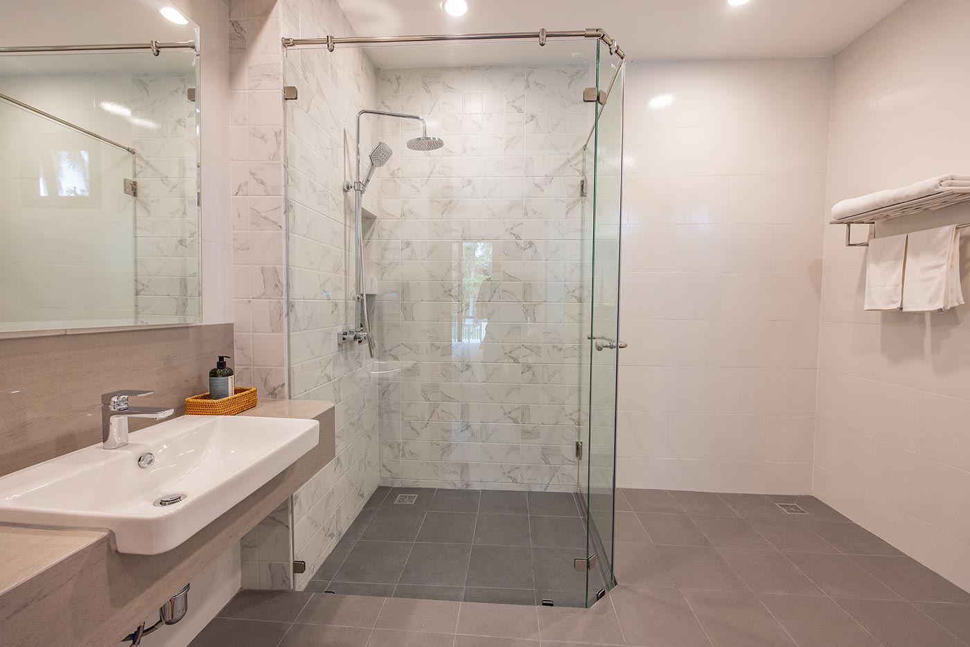 Official ThaiLife Residences project image showing modern bathroom with glass shower for the Bang Muang, Takua Pa development. Confirm whether the image is completed-property photography, a show unit or a design visualisation before using it as construction-status evidence.