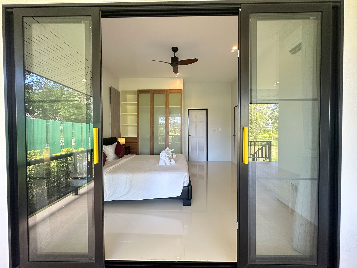 Official ThaiLife Residences project image showing modern bedroom sliding glass doors for the Bang Muang, Takua Pa development. Confirm whether the image is completed-property photography, a show unit or a design visualisation before using it as construction-status evidence.
