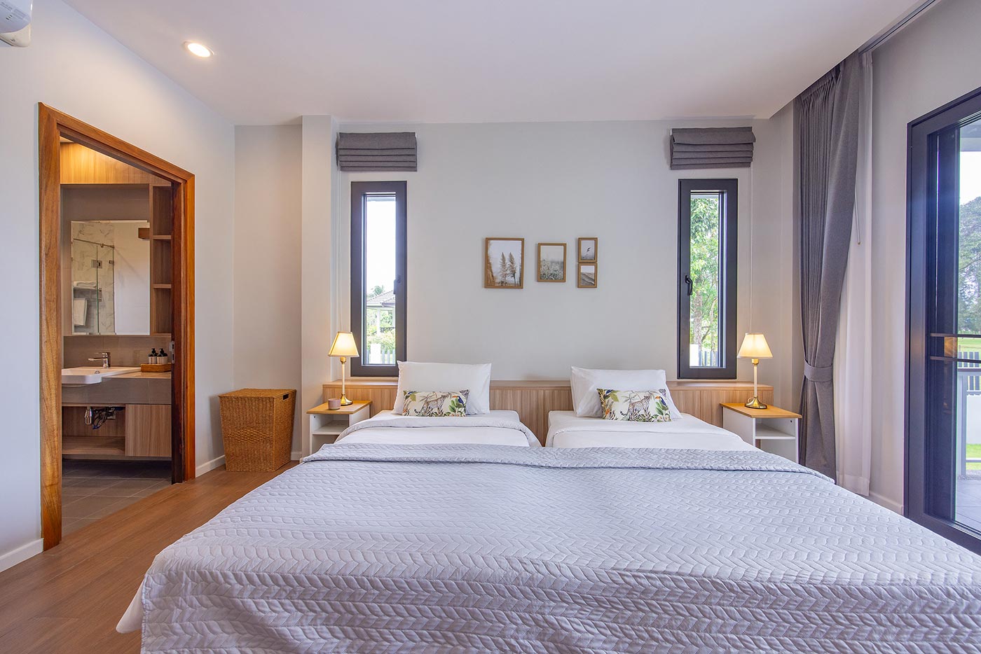Official ThaiLife Residences project image showing modern bedroom twin beds ensuite bathroom for the Bang Muang, Takua Pa development. Confirm whether the image is completed-property photography, a show unit or a design visualisation before using it as construction-status evidence.