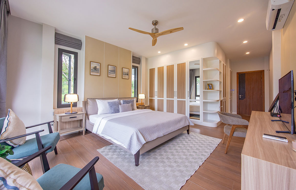 Official ThaiLife Residences project image showing modern bedroom with bed chairs and closet for the Bang Muang, Takua Pa development. Confirm whether the image is completed-property photography, a show unit or a design visualisation before using it as construction-status evidence.