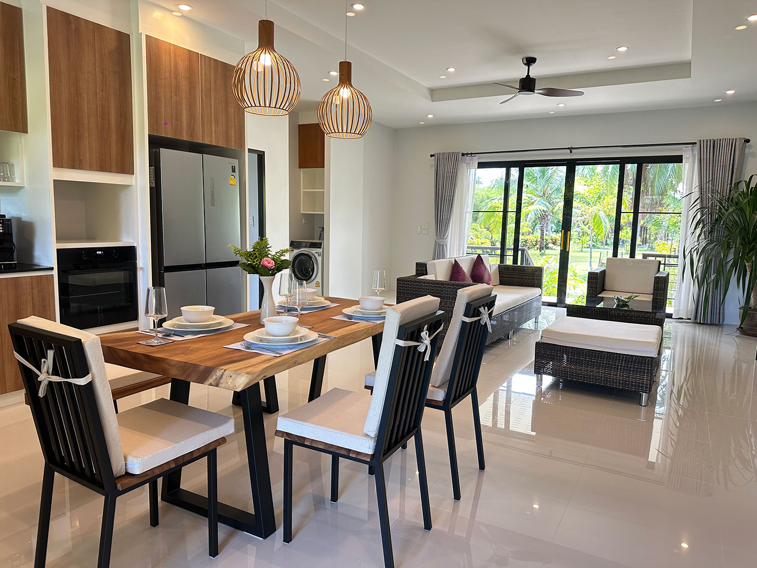 Official ThaiLife Residences project image showing modern dining table open living room for the Bang Muang, Takua Pa development. Confirm whether the image is completed-property photography, a show unit or a design visualisation before using it as construction-status evidence.