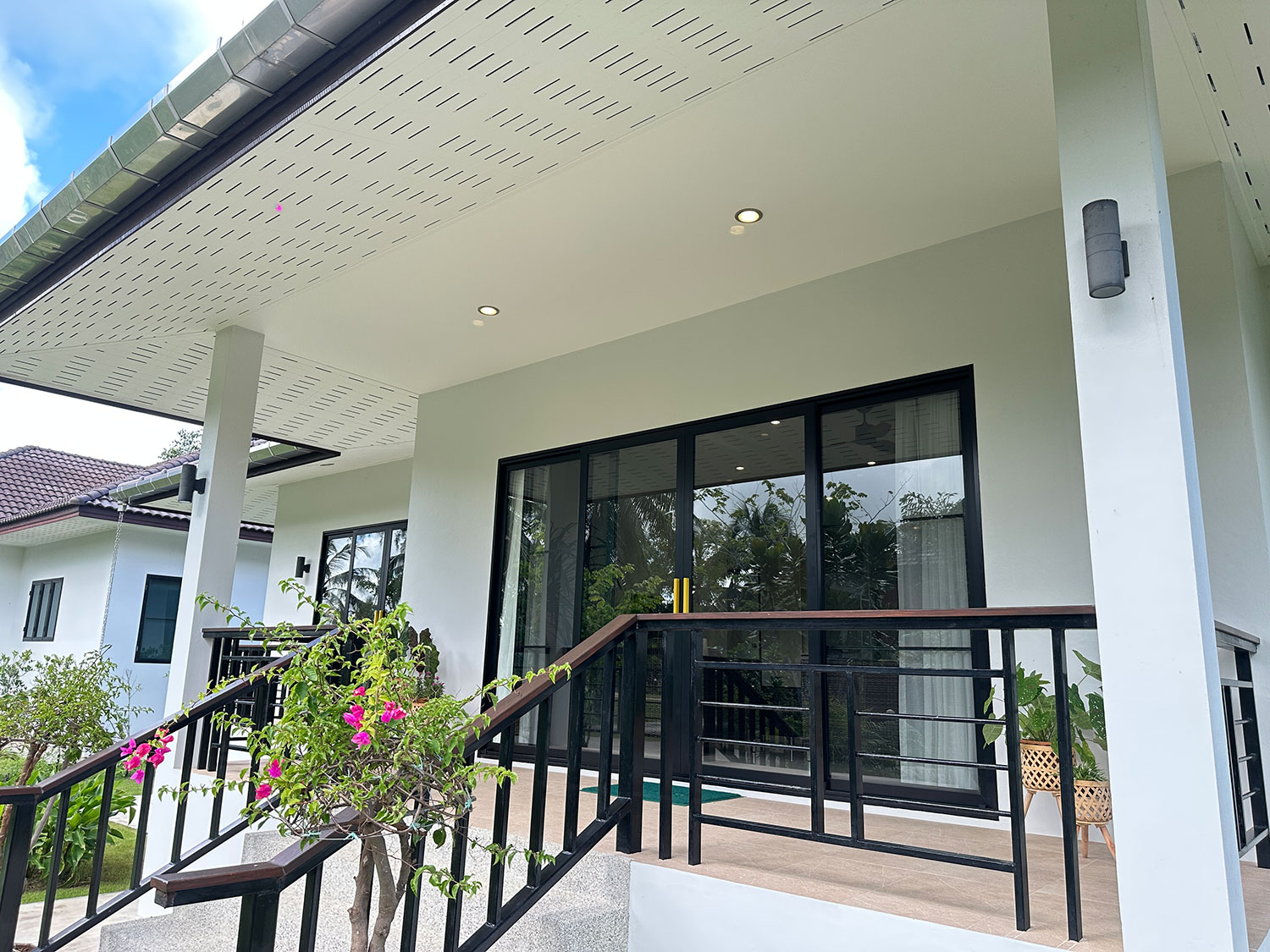 Official ThaiLife Residences project image showing modern home entrance porch railing for the Bang Muang, Takua Pa development. Confirm whether the image is completed-property photography, a show unit or a design visualisation before using it as construction-status evidence.