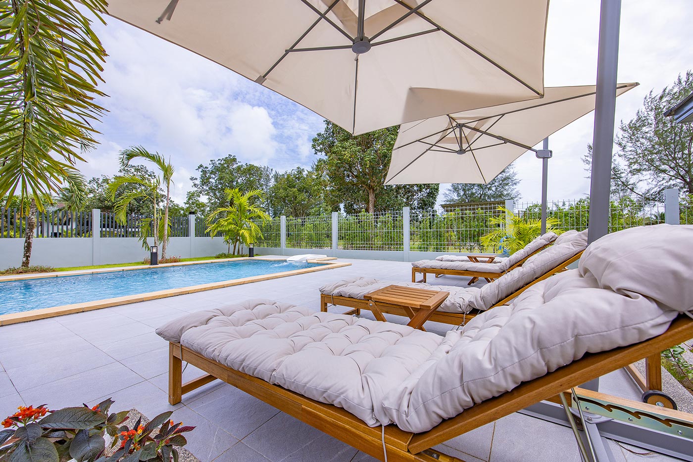 Official ThaiLife Residences project image showing modern home pool lounge area outdoors for the Bang Muang, Takua Pa development. Confirm whether the image is completed-property photography, a show unit or a design visualisation before using it as construction-status evidence.