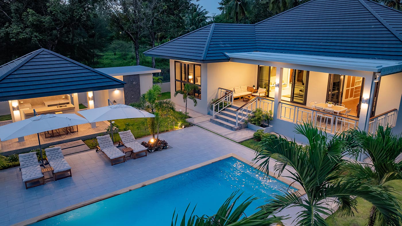 Official ThaiLife Residences project image showing modern home with pool and outdoor lounge for the Bang Muang, Takua Pa development. Confirm whether the image is completed-property photography, a show unit or a design visualisation before using it as construction-status evidence.