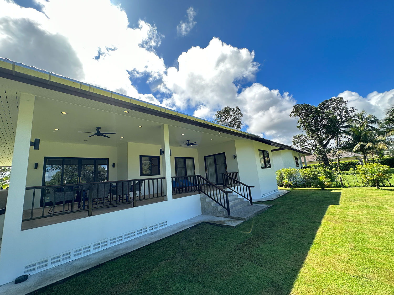 Official ThaiLife Residences project image showing modern house exterior porch garden view for the Bang Muang, Takua Pa development. Confirm whether the image is completed-property photography, a show unit or a design visualisation before using it as construction-status evidence.