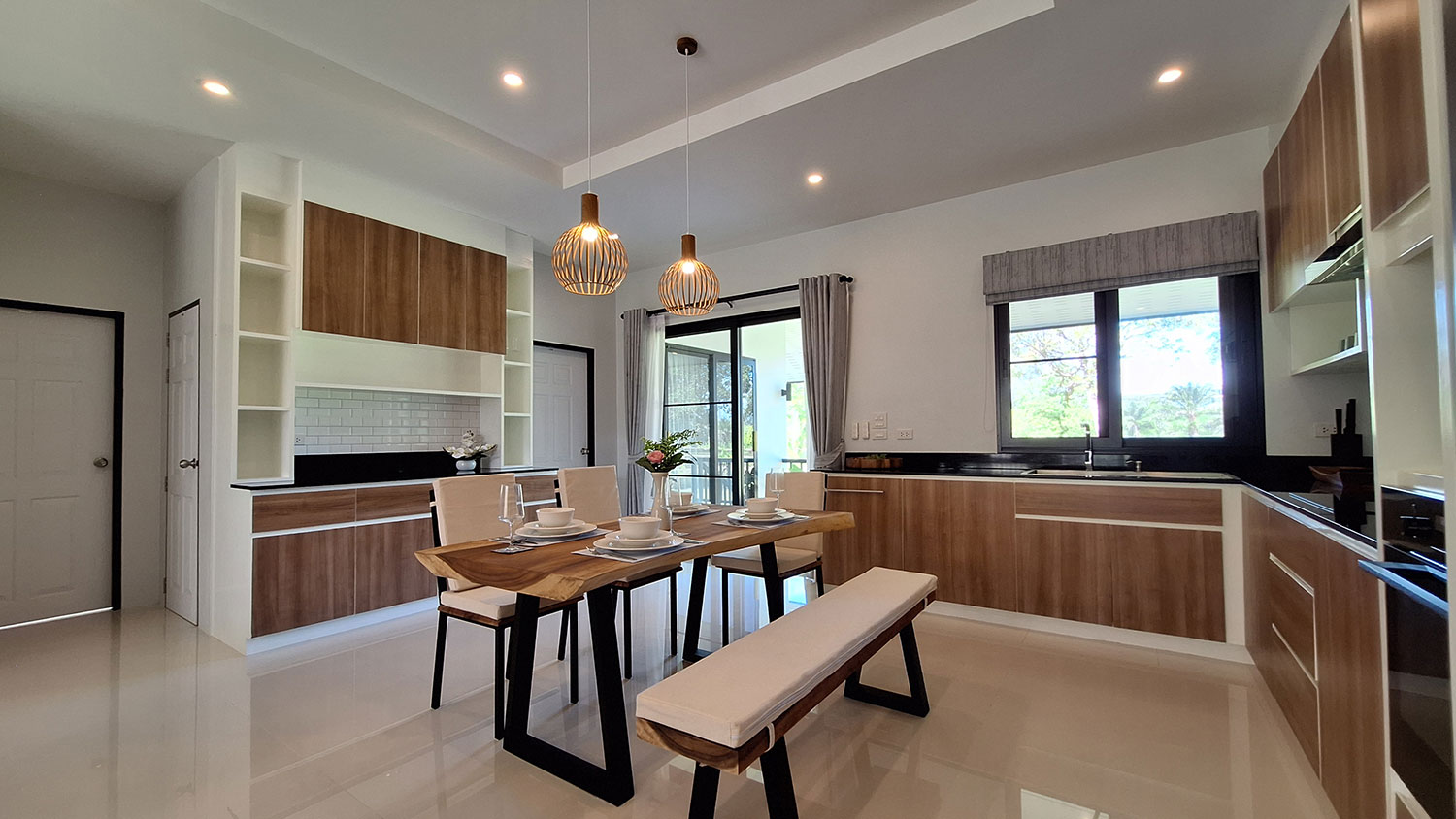 Official ThaiLife Residences project image showing modern kitchen dining area home for the Bang Muang, Takua Pa development. Confirm whether the image is completed-property photography, a show unit or a design visualisation before using it as construction-status evidence.