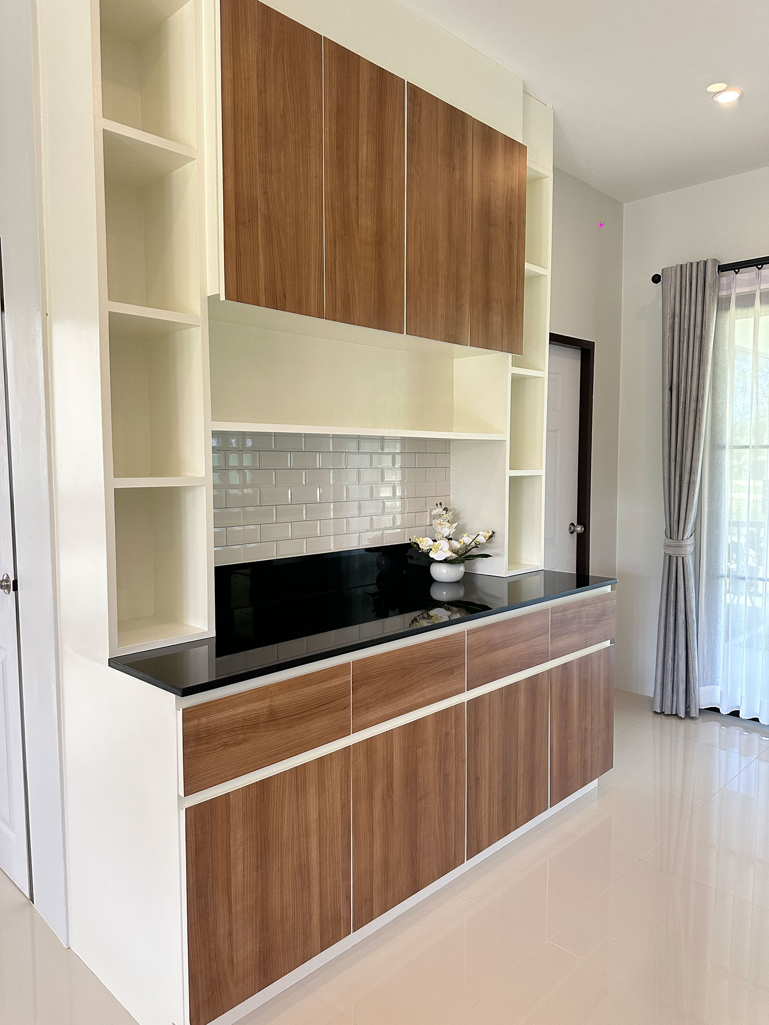 Official ThaiLife Residences project image showing modern kitchen storage cabinets countertop for the Bang Muang, Takua Pa development. Confirm whether the image is completed-property photography, a show unit or a design visualisation before using it as construction-status evidence.