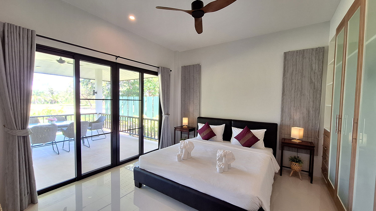 Official ThaiLife Residences project image showing modern master bedroom balcony view for the Bang Muang, Takua Pa development. Confirm whether the image is completed-property photography, a show unit or a design visualisation before using it as construction-status evidence.
