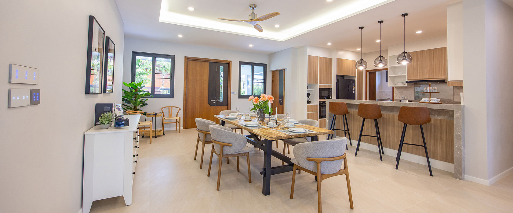 Official ThaiLife Residences project image showing modern open plan dining kitchen home for the Bang Muang, Takua Pa development. Confirm whether the image is completed-property photography, a show unit or a design visualisation before using it as construction-status evidence.
