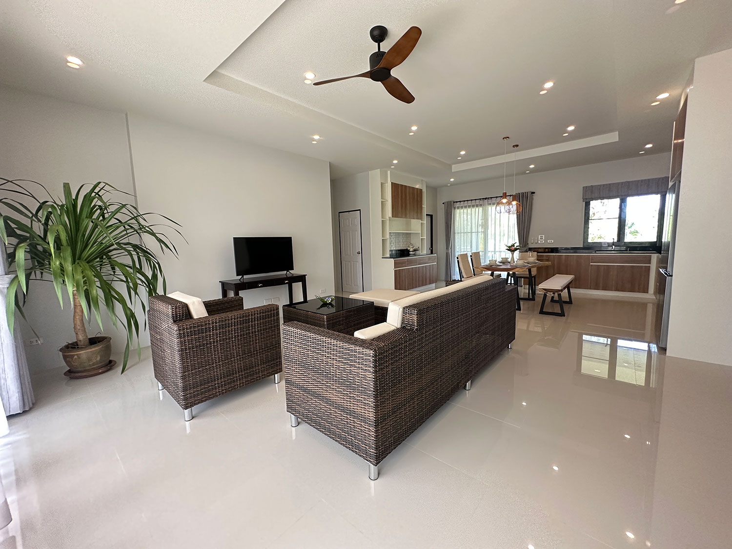 Official ThaiLife Residences project image showing modern open plan living room dining kitchen for the Bang Muang, Takua Pa development. Confirm whether the image is completed-property photography, a show unit or a design visualisation before using it as construction-status evidence.