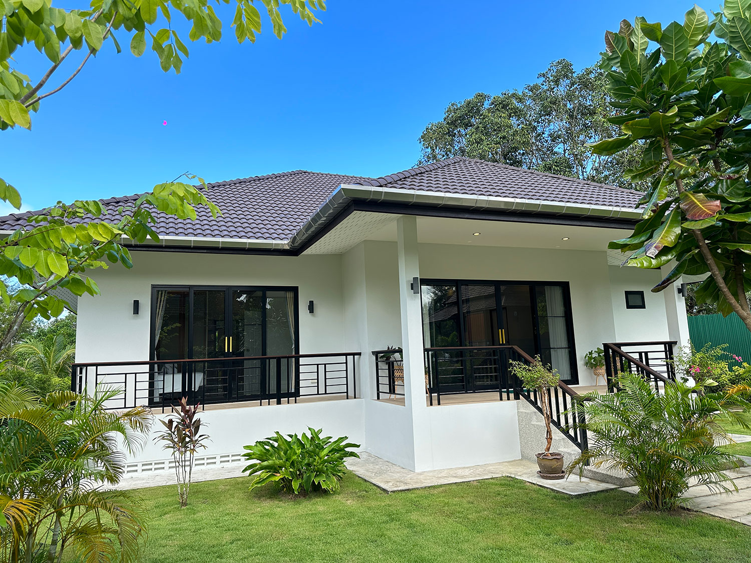Official ThaiLife Residences project image showing modern single story home exterior garden thailife residences for the Bang Muang, Takua Pa development. Confirm whether the image is completed-property photography, a show unit or a design visualisation before using it as construction-status evidence.