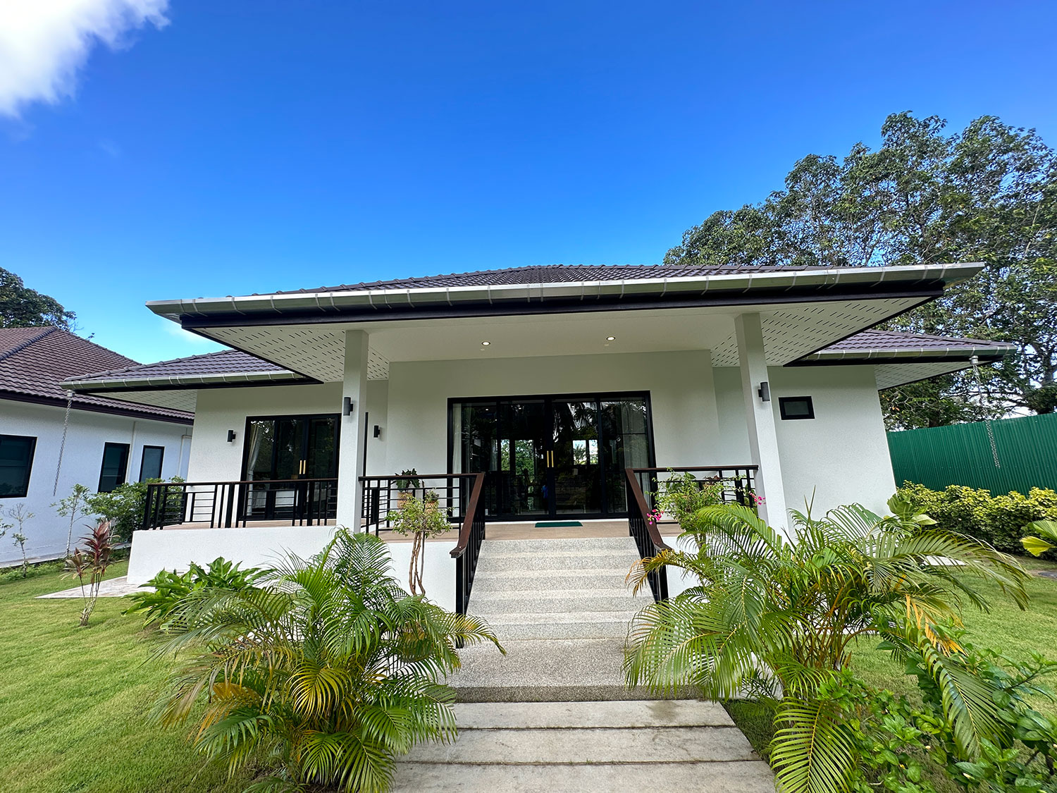 Official ThaiLife Residences project image showing modern single story home exterior garden for the Bang Muang, Takua Pa development. Confirm whether the image is completed-property photography, a show unit or a design visualisation before using it as construction-status evidence.
