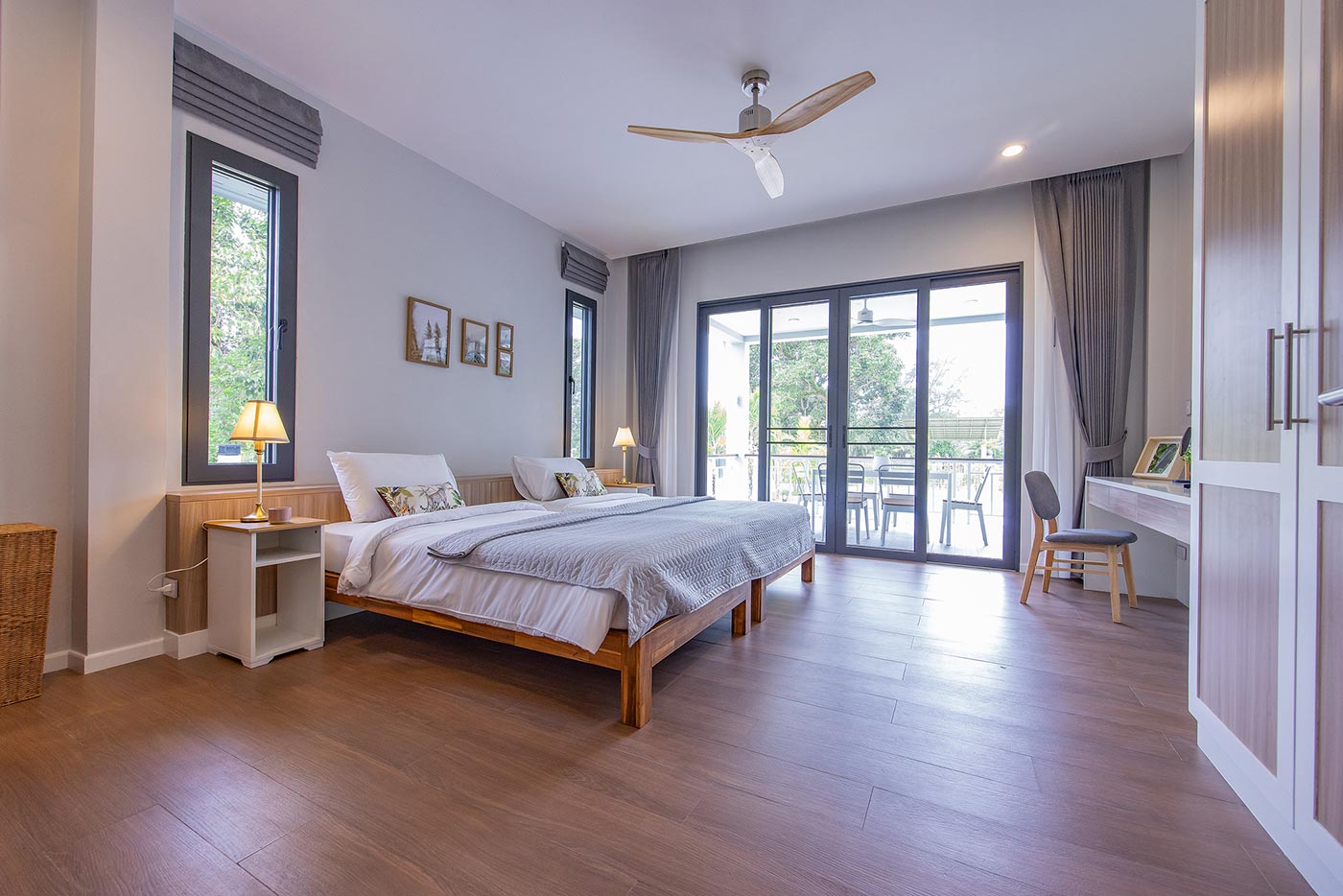 Official ThaiLife Residences project image showing modern spacious bedroom with balcony view for the Bang Muang, Takua Pa development. Confirm whether the image is completed-property photography, a show unit or a design visualisation before using it as construction-status evidence.