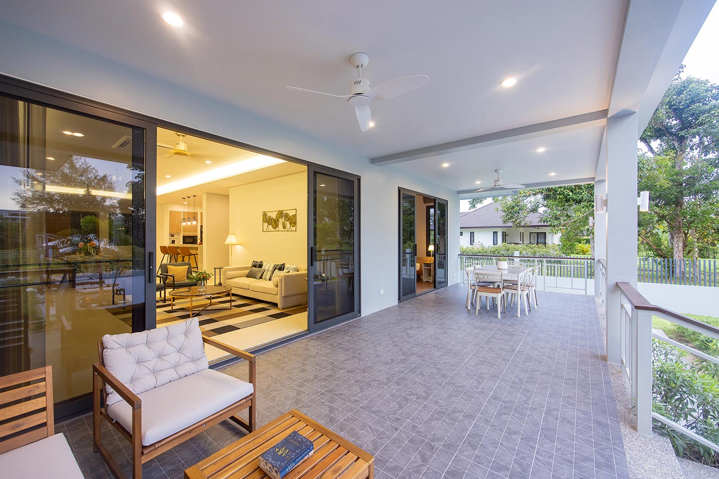 Official ThaiLife Residences project image showing spacious balcony connected to living room for the Bang Muang, Takua Pa development. Confirm whether the image is completed-property photography, a show unit or a design visualisation before using it as construction-status evidence.
